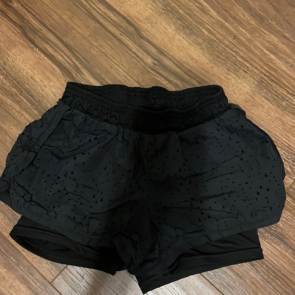 Champion, medium, black, spandex with triangle added fabric.